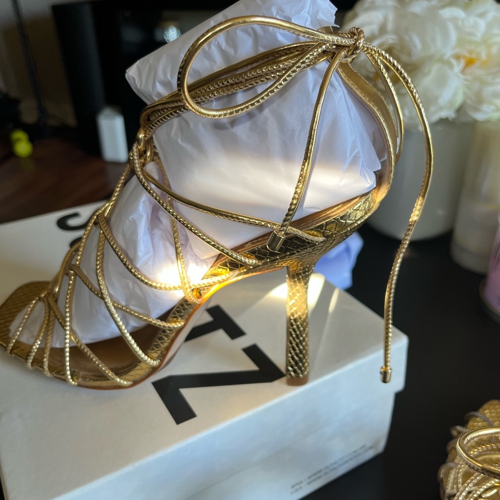 Gold strappy heels